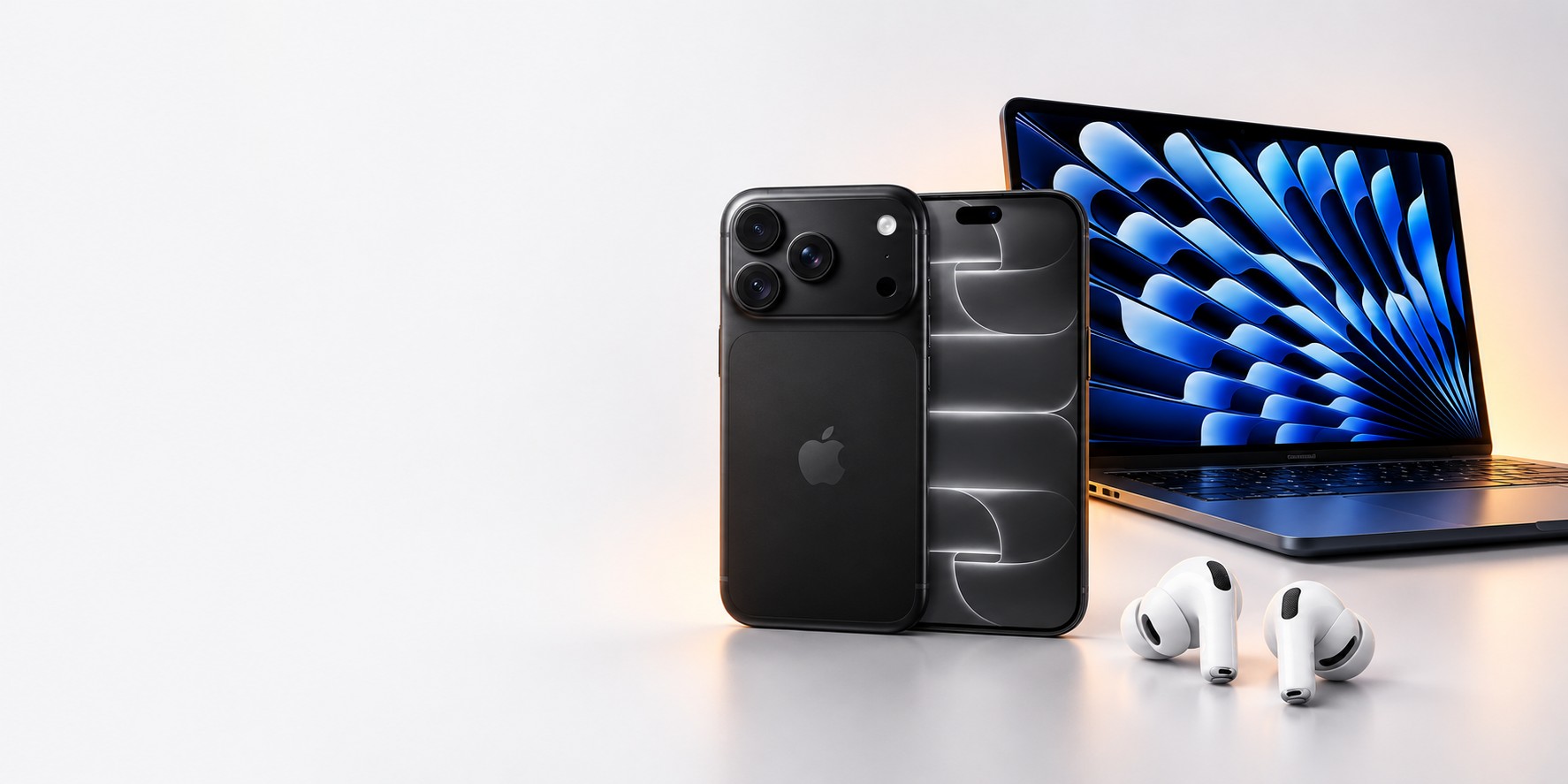 Composición de iPhone, MacBook y AirPods sobre un fondo claro
